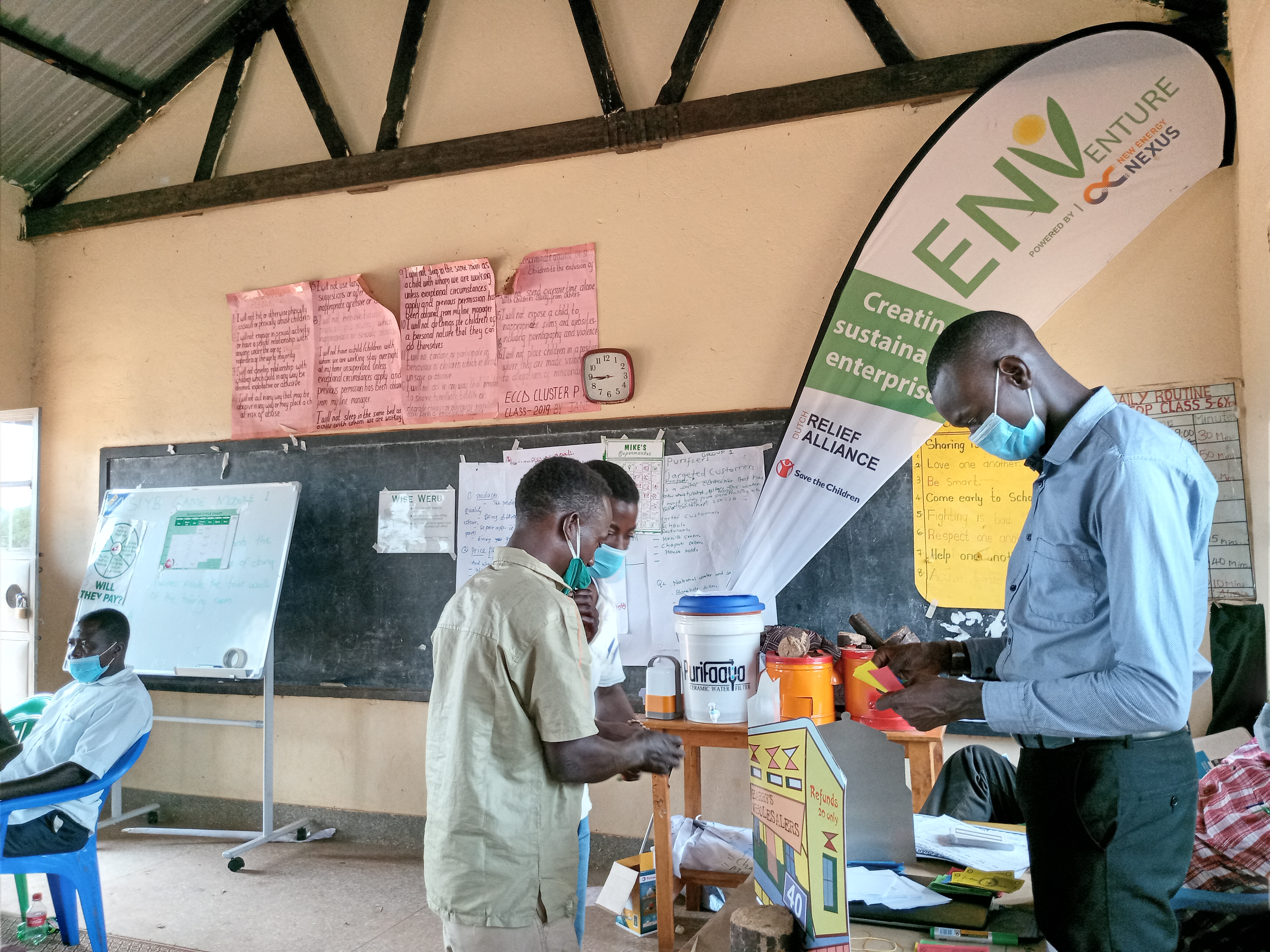 members from oribcing energy cooperative agreeing on a savings plan during a business development game