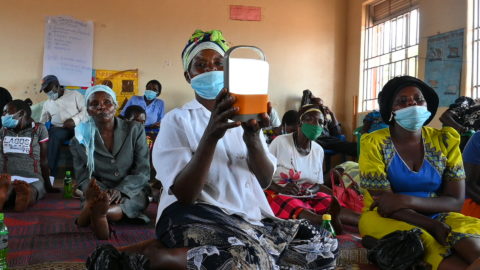 an energy entrepreneur testing the lighting capability of a solar lantern during the boot camp in 2021 (1)