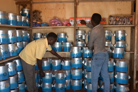 reverand and daniel of children's hope ministry in kiryandongo refugee settlemet taking count of their stock in their energy business. we recently extended our model to humanitarian settings