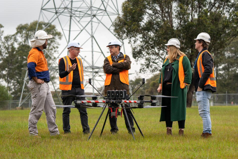 EnergyLab's Megan Fisher (second from right) and NEX's Danny Kennedy (centre) with the team from Infravision. Image: EnergyLab