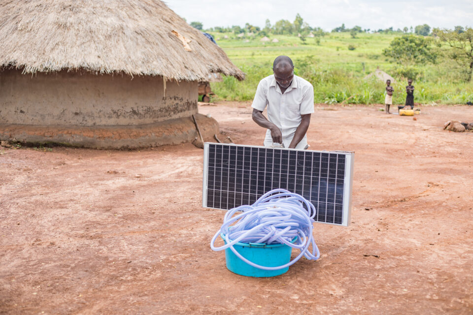 october 31, purongo town council, northern uganda opiyo ronald of atek ki lwak group poses with the solar powered irrigation kit.
